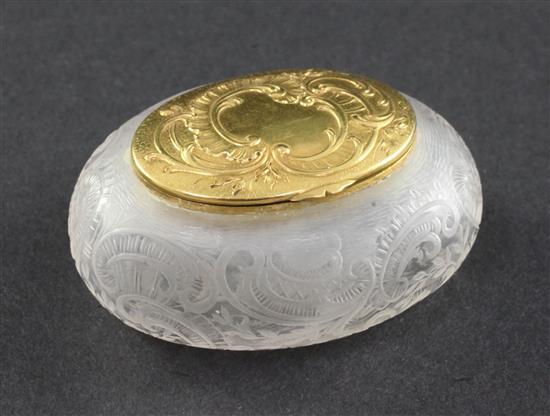 An early 20th century French 18ct gold mounted rock crystal oval snuff box, 2.25in.